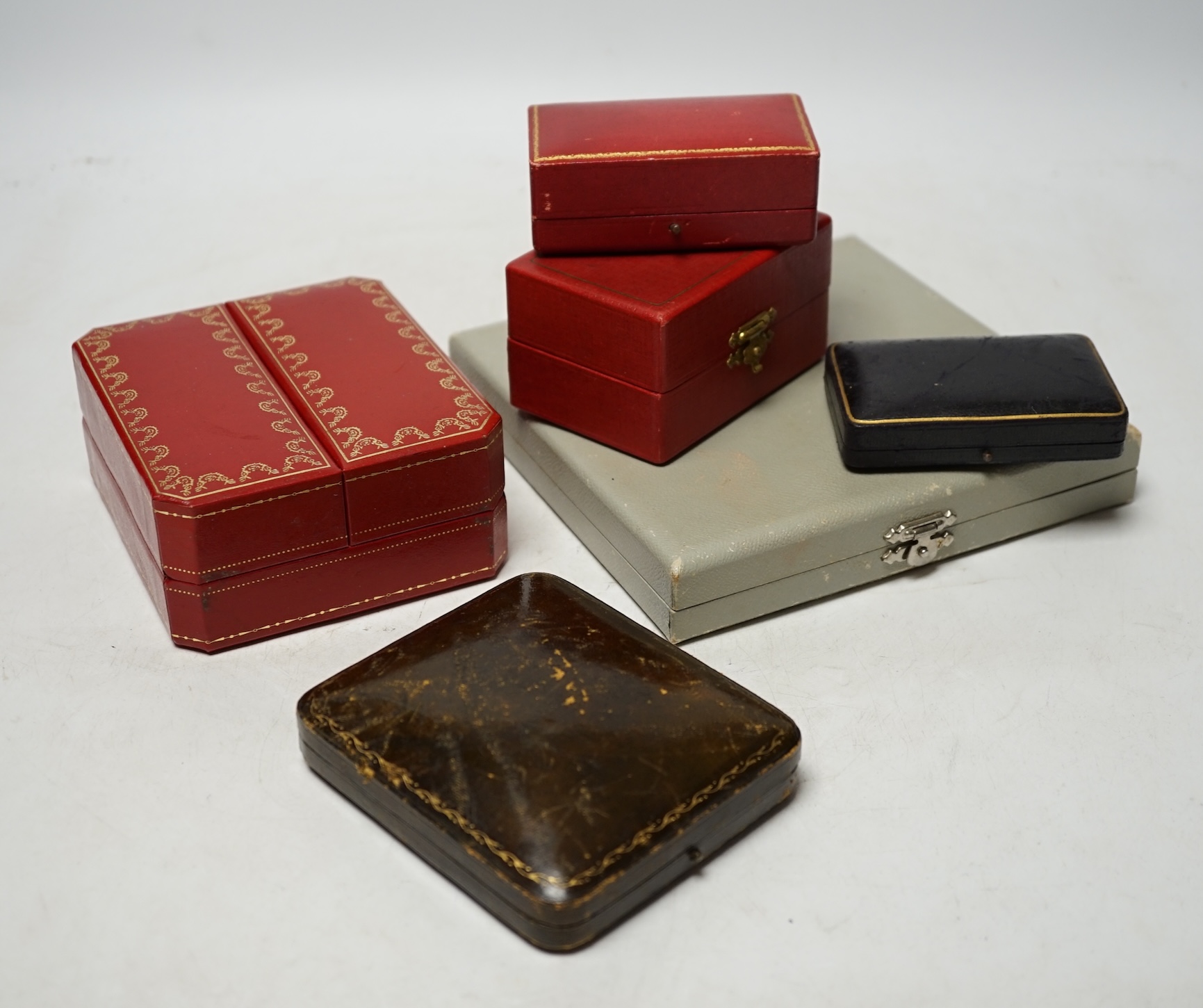 A quantity of assorted jewellery boxes, including Cartier, Must de Cartier and T. Kishanchand. Condition - poor to fair to good